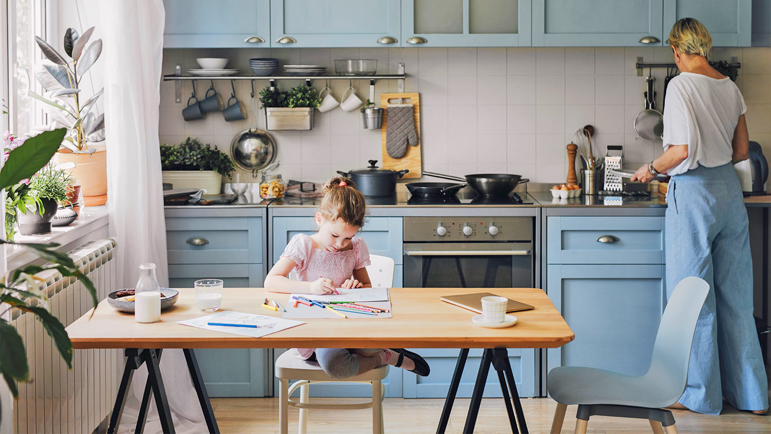 Big kitchen blue cabinet family table kid mom window