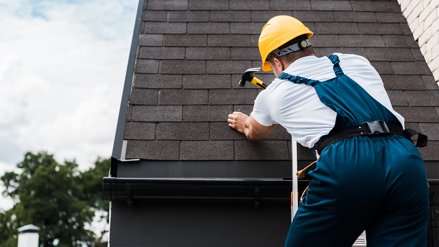 handyman working on roof repair  