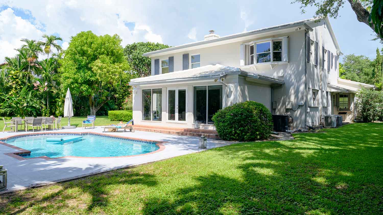 Two story house with swimming pool in the backyard