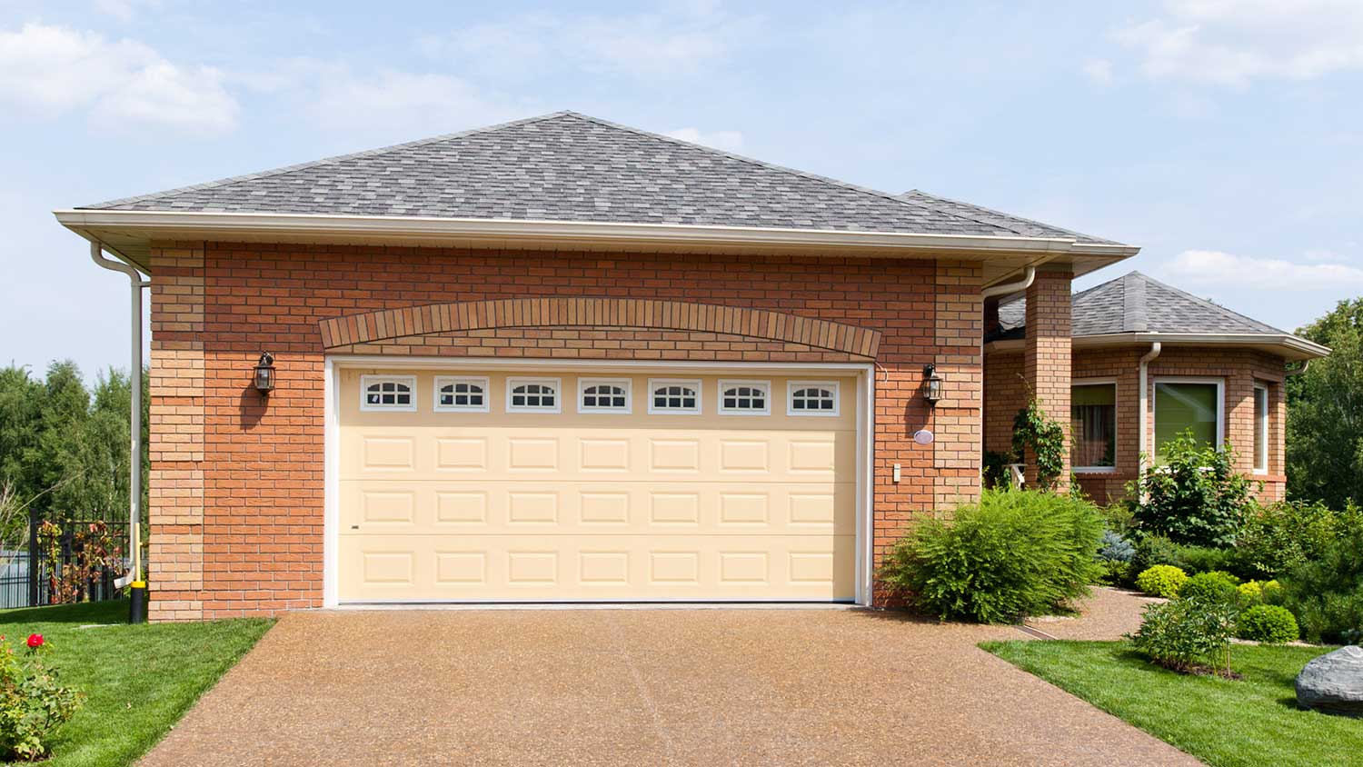 Brick house with yellow garage door
